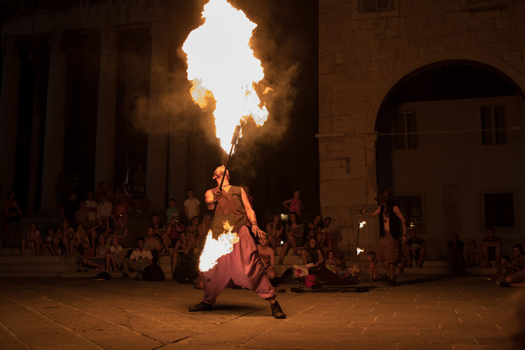 Photographer at street event where a spectacular show took place. I photograph in the Brussels, Leuven, Flemish Brabant area.